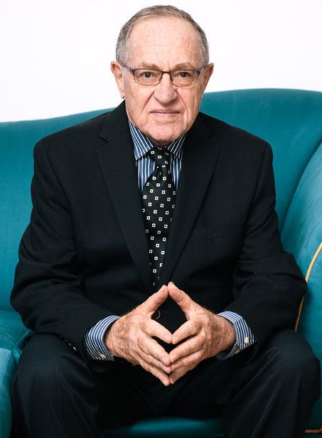 Dershowitz making some kind of Kabbalist-masonic pose.
