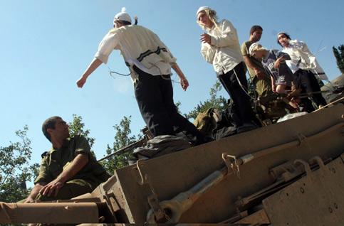 Israelis dancing on tank