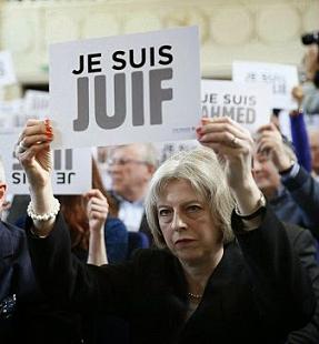 Theresa May, Britain's Home Secretary, holding up a poster saying ''I am a Jew."